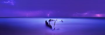 A furious electrical storm quickly passes over the Sunshine Coast, creating a surreal scene as hundreds of bolts of lightning strike over the wreck of the S.S Dicky. 7th place at the International Epson Pano Awards.