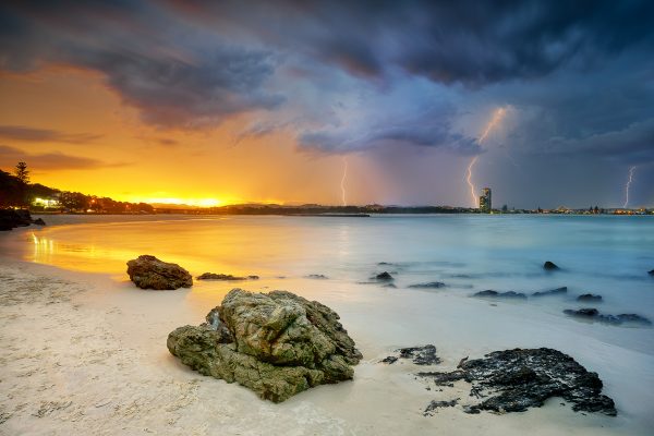 A storm front approaches Currumbin Beach at Sunset - Gold Coast.