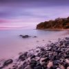 Sunset over Little Cove in the Noosa National Park, Queensland.