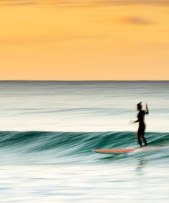 Surfing at sunset - Kirra, Gold Coast.