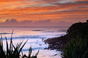 Surfer at sunrise - Burleigh Heads, Gold Coast.