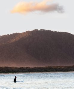 Surfing at sunset at Diamond Head, NSW.
